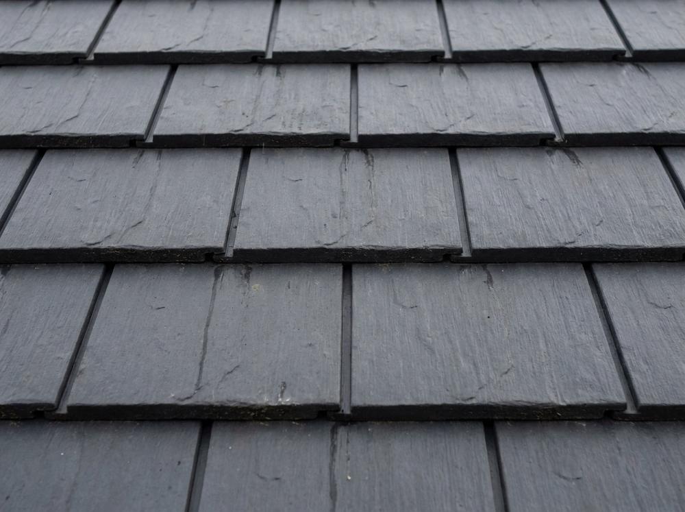 Synthetic composite slate roof in uniform charcoal